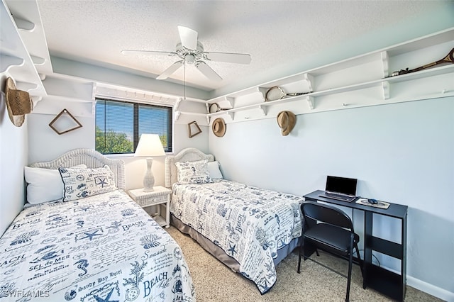 bedroom with ceiling fan and a textured ceiling