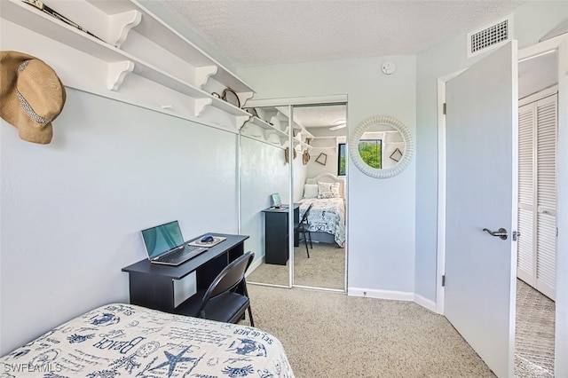 bedroom featuring a closet and a textured ceiling