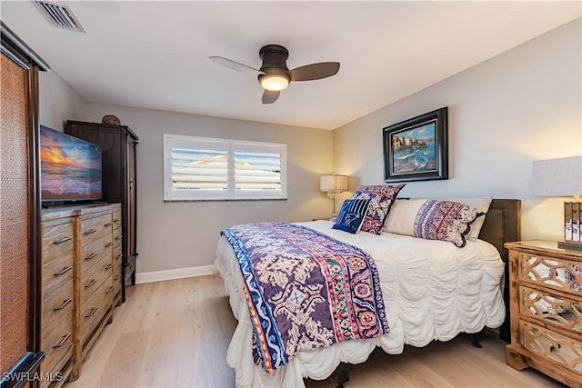 bedroom with ceiling fan and light wood-type flooring