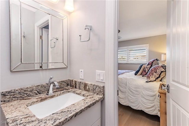 bathroom with vanity and wood-type flooring