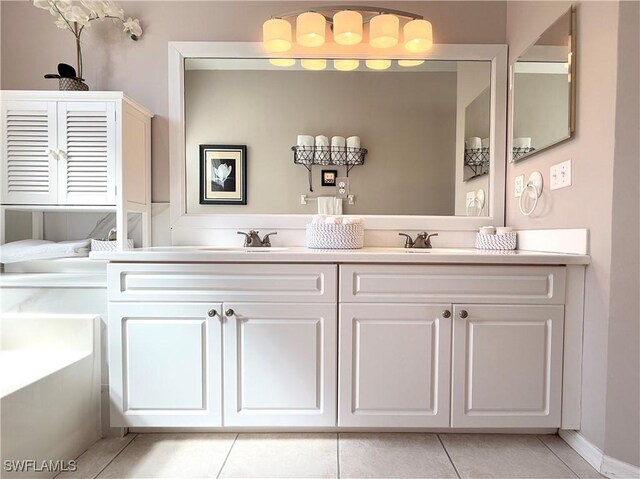 8744 Naples Heritage Dr Unit E28, Naples, FL 34112 - bathroom with vanity, a bath, and tile patterned flooring