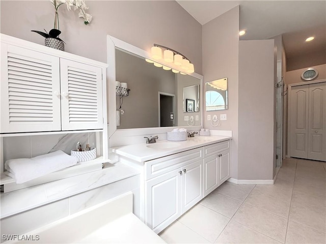 8744 Naples Heritage Dr Unit E28, Naples, FL 34112 - bathroom with walk in shower, tile patterned floors, and vanity