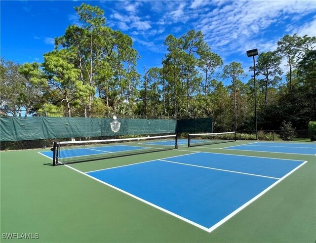 8744 Naples Heritage Dr Unit E28, Naples, FL 34112 - view of sport court with basketball hoop