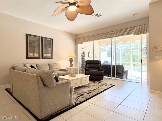 8744 Naples Heritage Dr Unit E28, Naples, FL 34112 - tiled living room with ceiling fan