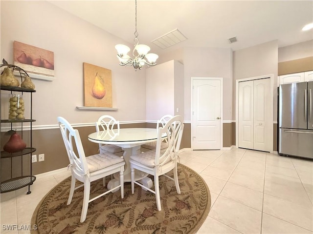 8744 Naples Heritage Dr Unit E28, Naples, FL 34112 - tiled dining room featuring a chandelier