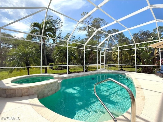 view of swimming pool featuring an in ground hot tub, a patio area, and glass enclosure