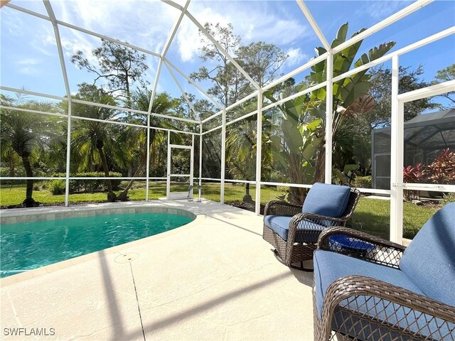 8744 Naples Heritage Dr Unit E28, Naples, FL 34112 - view of pool with a patio and glass enclosure