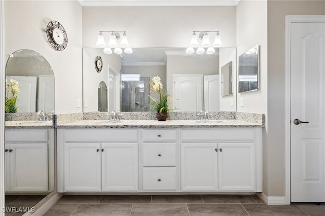 bathroom with vanity and ornamental molding