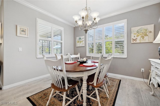 dining area with crown molding, a chandelier, and light wood-type flooring