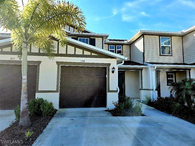 townhome / multi-family property featuring a garage