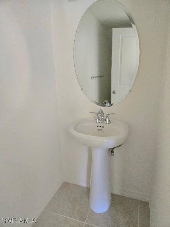 bathroom with tile patterned floors