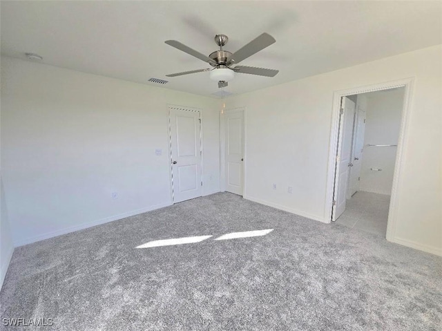 unfurnished bedroom with ceiling fan and light carpet