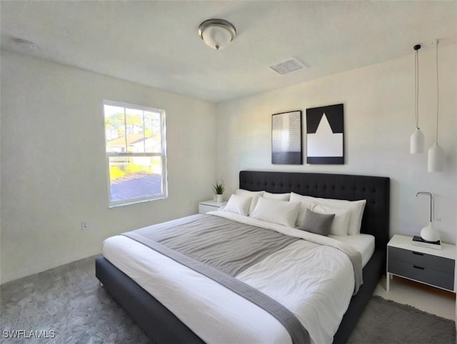 bedroom with dark carpet