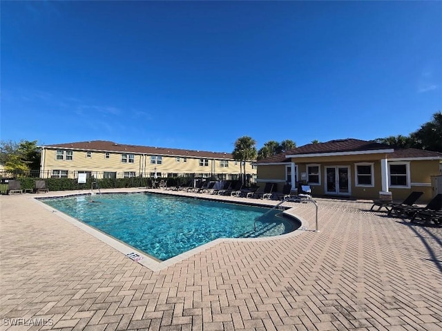 view of swimming pool featuring a patio area