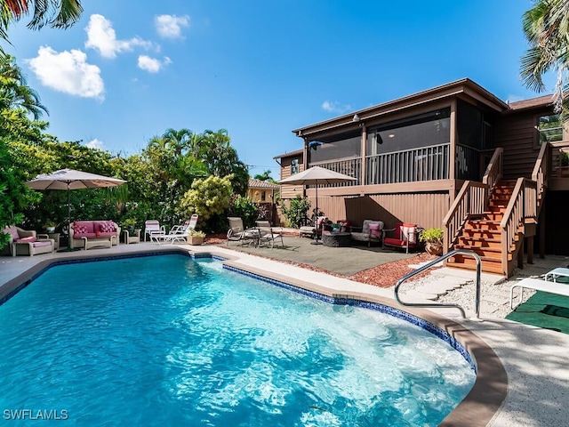 view of swimming pool with a patio and a sunroom