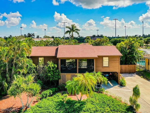 ranch-style home featuring a carport