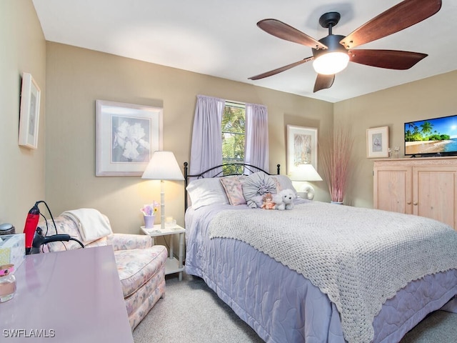 bedroom featuring ceiling fan and light carpet