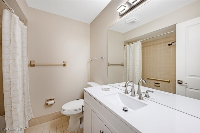 bathroom featuring walk in shower, vanity, toilet, and tile patterned flooring