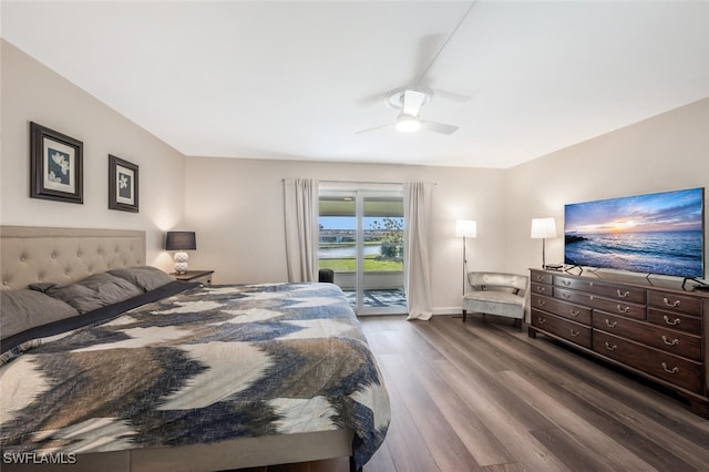 bedroom with dark wood-type flooring, ceiling fan, and access to exterior