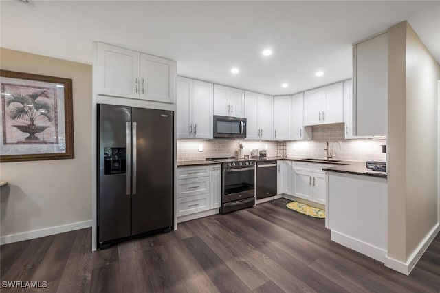 kitchen with white cabinetry, stainless steel appliances, dark wood-type flooring, and tasteful backsplash