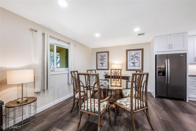 dining space featuring dark hardwood / wood-style floors