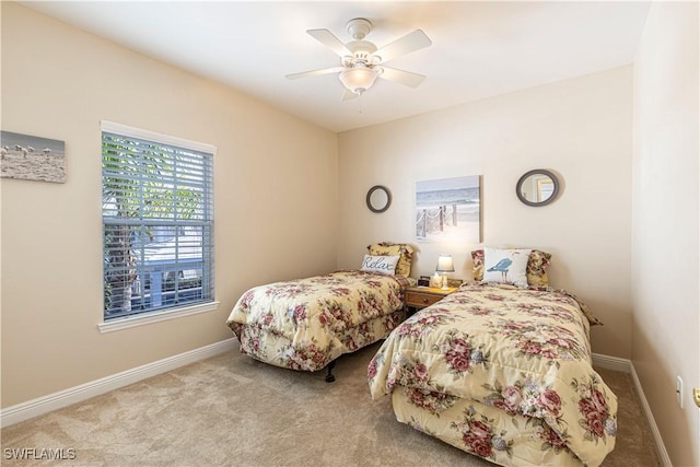 bedroom with light colored carpet and ceiling fan