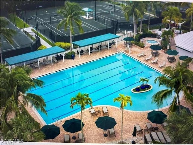 view of swimming pool featuring a community hot tub