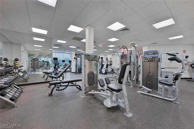 workout area with a drop ceiling