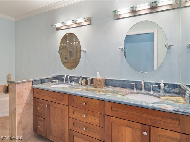 bathroom featuring crown molding and vanity