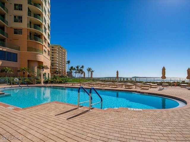 view of swimming pool featuring a patio area