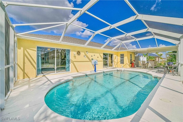 view of pool with a lanai and a patio