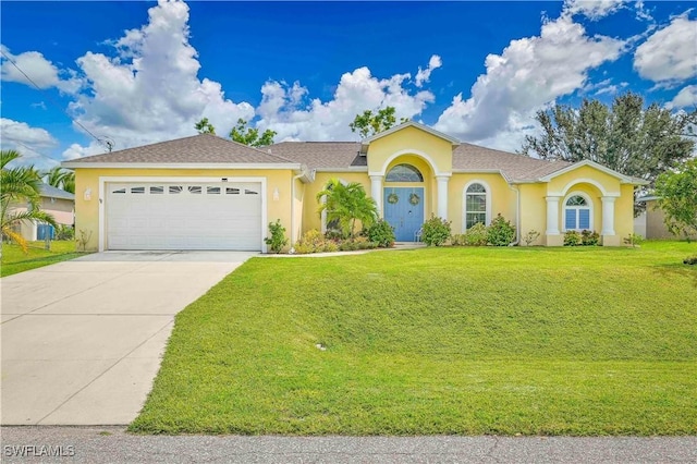 view of front facade with a garage and a front lawn