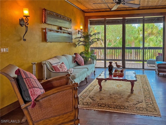 sunroom featuring a wealth of natural light, wood ceiling, and ceiling fan