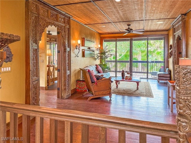 living room with hardwood / wood-style floors, wood ceiling, and ceiling fan