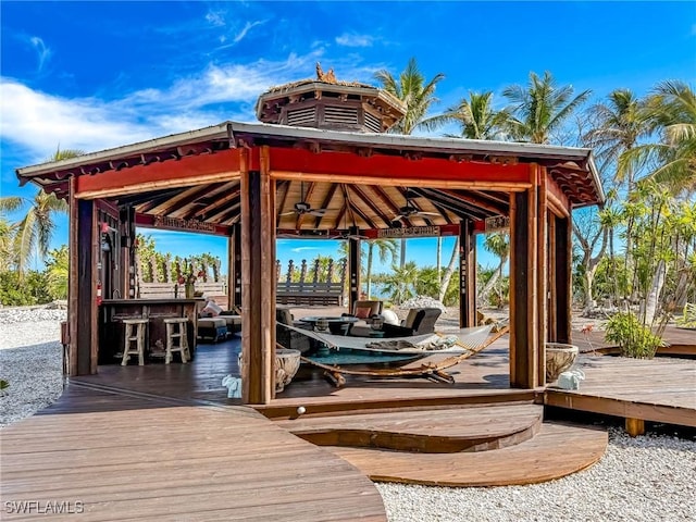 dock area featuring a gazebo and a deck