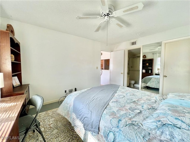 bedroom with ceiling fan and a textured ceiling