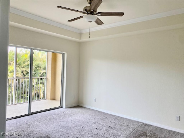 spare room featuring crown molding, plenty of natural light, and carpet