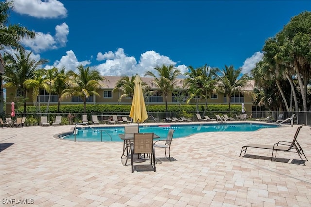 view of swimming pool featuring a patio area