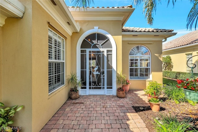 property entrance with a patio