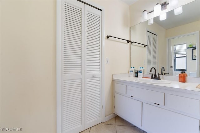 bathroom with tile patterned flooring and vanity