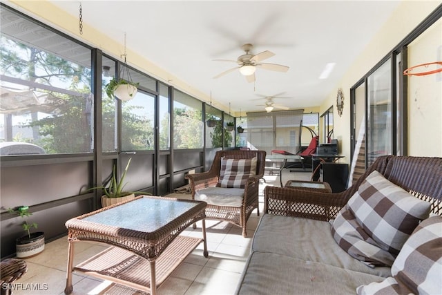 sunroom featuring ceiling fan