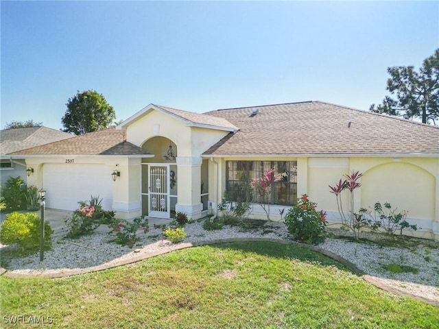 single story home with a garage and a front yard