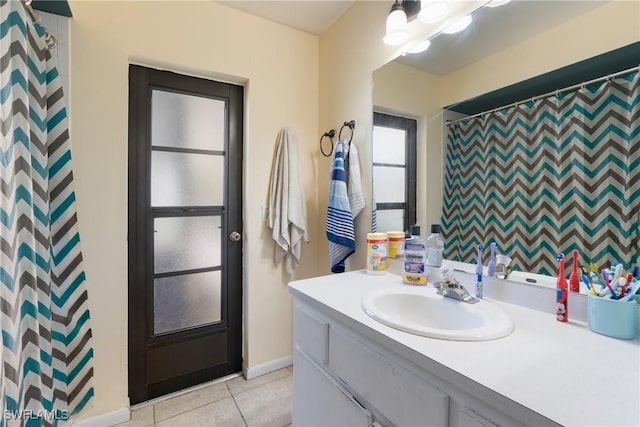 bathroom with vanity, a shower with curtain, and tile patterned floors