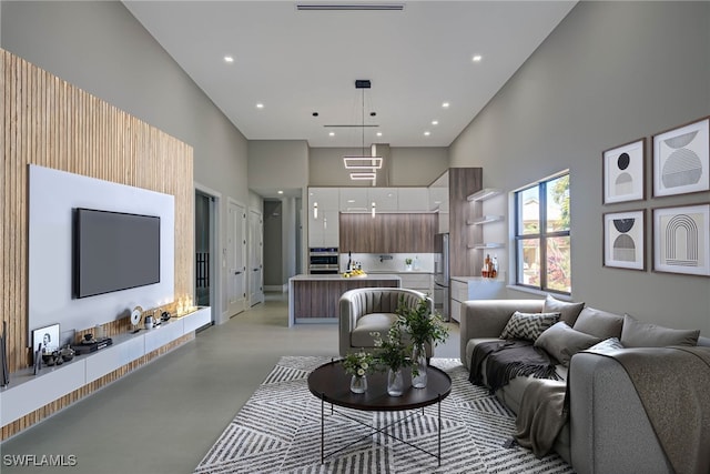 living room featuring a high ceiling