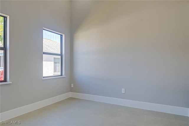 unfurnished room featuring plenty of natural light