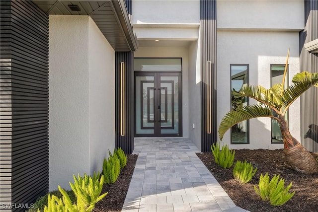 property entrance featuring french doors