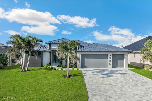 view of front facade featuring a garage and a front lawn