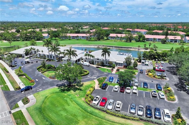 aerial view featuring view of golf course and a water view