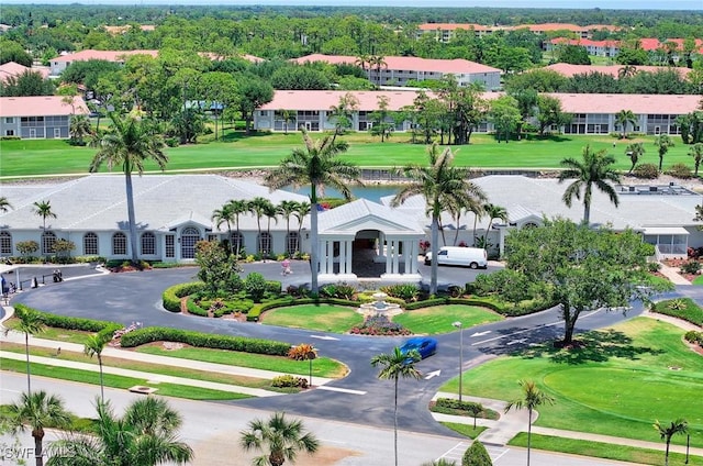 drone / aerial view with a residential view and golf course view