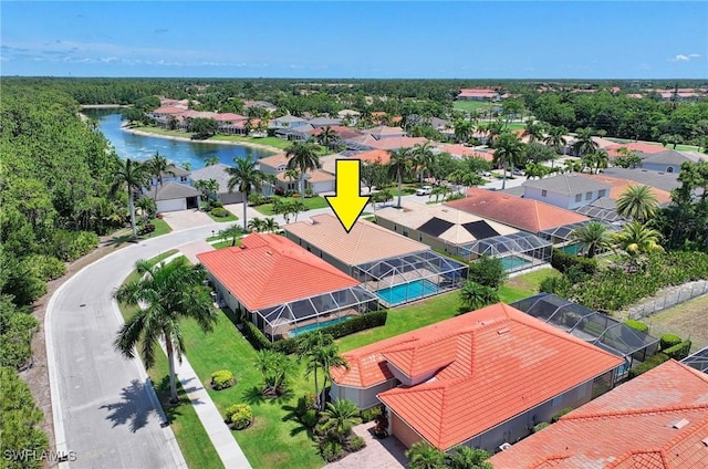 birds eye view of property featuring a water view